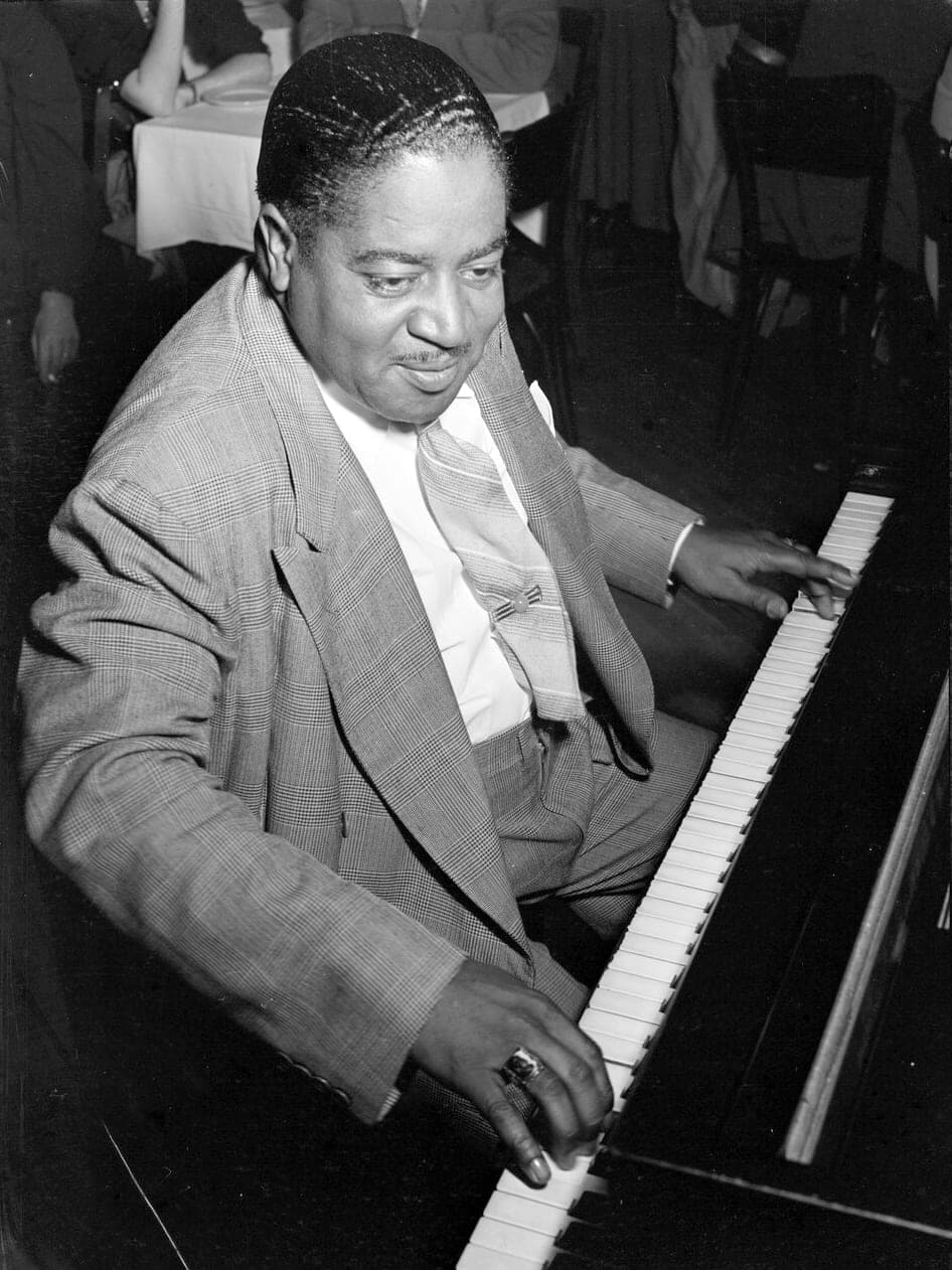 Pete Johnson, boogie-woogie and blues pianist, at the piano in 1946